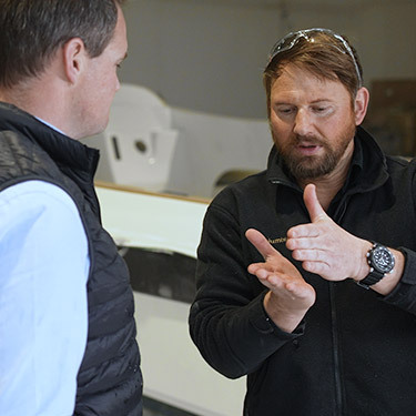 Sabre company 2 staff members talking