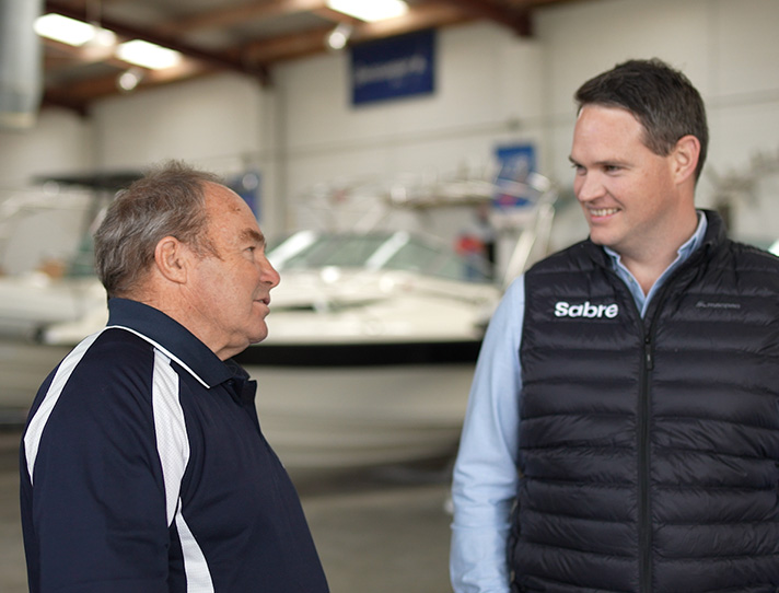 Sabre company 2 management staff members talking